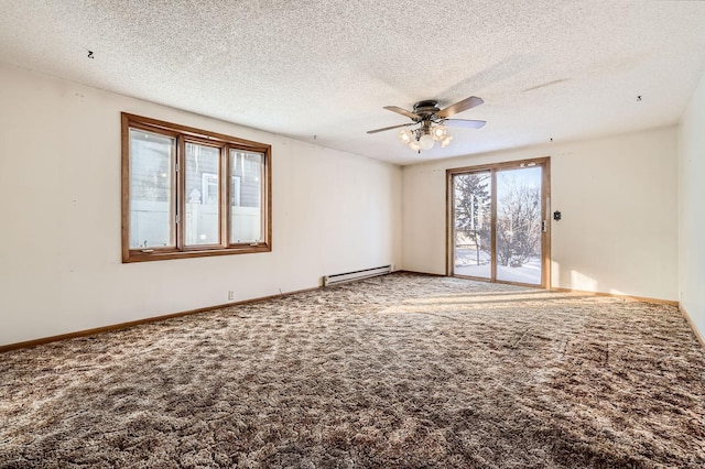 carpeted spare room with a baseboard radiator, baseboards, and ceiling fan