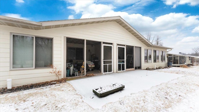 back of house with a sunroom