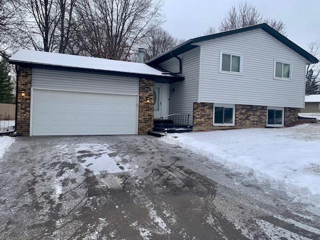 split level home with a garage