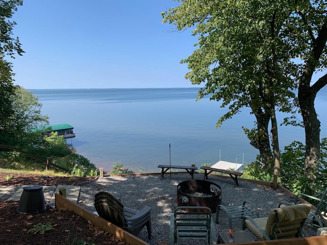 view of water feature with an outdoor fire pit