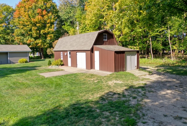 view of outbuilding featuring a yard