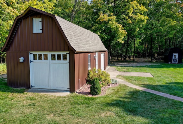 garage featuring a lawn