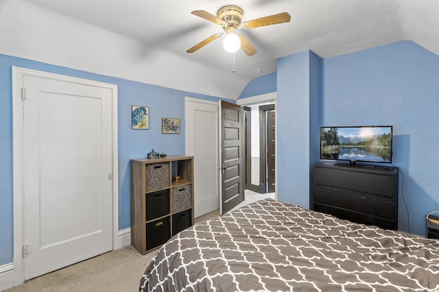 bedroom with lofted ceiling, carpet floors, and a ceiling fan