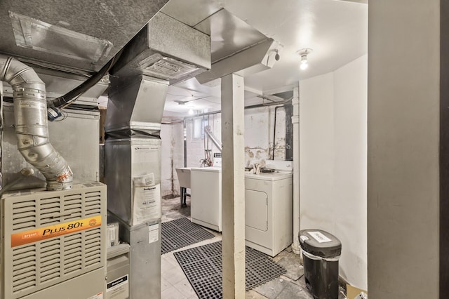 unfinished basement with washer / clothes dryer