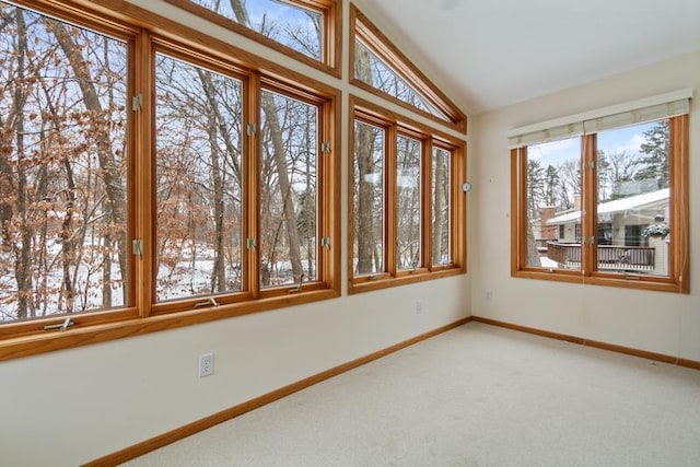 unfurnished sunroom with lofted ceiling and a healthy amount of sunlight