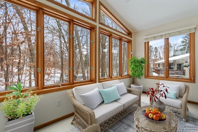 sunroom featuring lofted ceiling