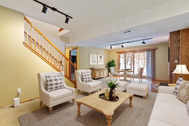 living room featuring track lighting