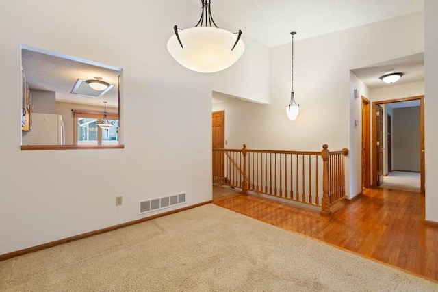 unfurnished room featuring carpet flooring