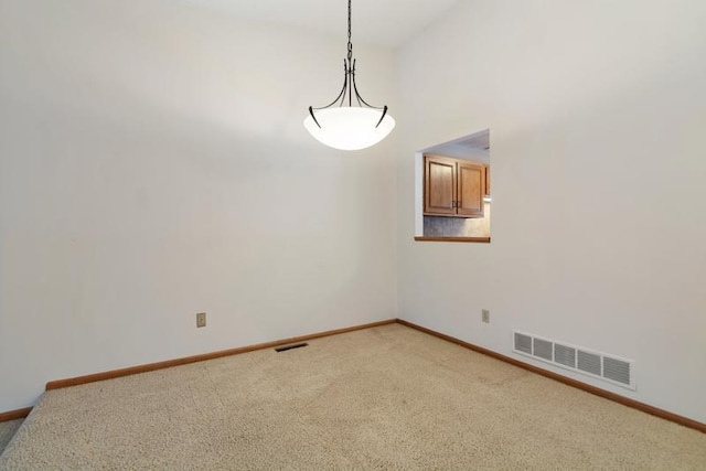 spare room featuring carpet flooring