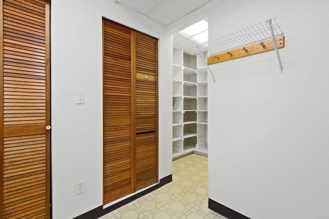 walk in closet featuring a paneled ceiling