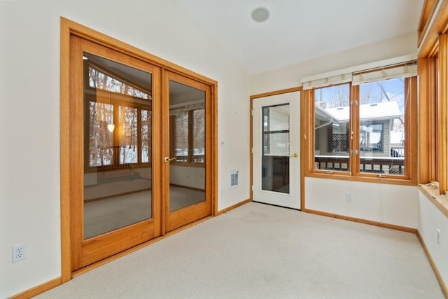 unfurnished sunroom with french doors and vaulted ceiling