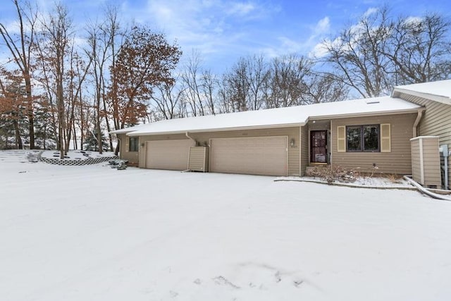 ranch-style house featuring a garage