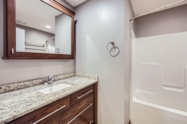 bathroom featuring vanity and bathing tub / shower combination