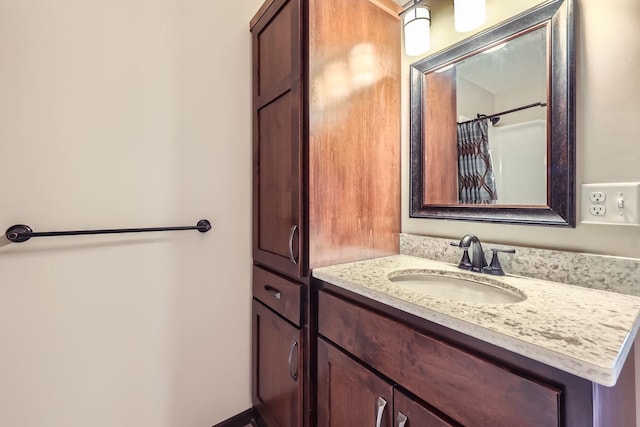 bathroom featuring vanity and a shower with curtain