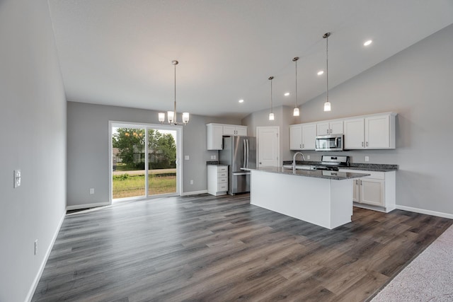 kitchen featuring a kitchen island with sink, appliances with stainless steel finishes, pendant lighting, sink, and white cabinetry