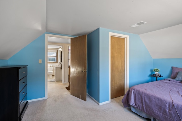 bedroom with lofted ceiling, baseboards, visible vents, and light carpet