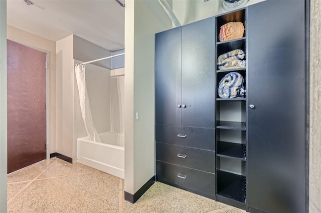 bathroom with shower / bath combo