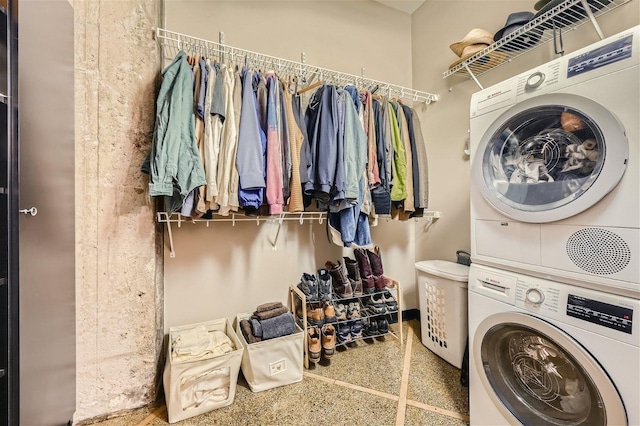 laundry room with stacked washer and clothes dryer