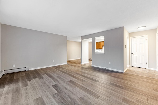 spare room with light hardwood / wood-style floors