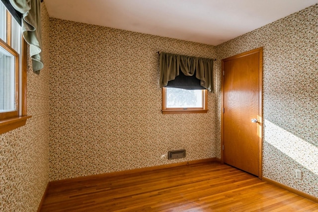 unfurnished room featuring wood-type flooring