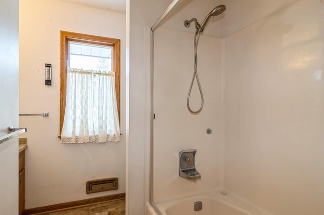 bathroom featuring shower / bath combination and vanity