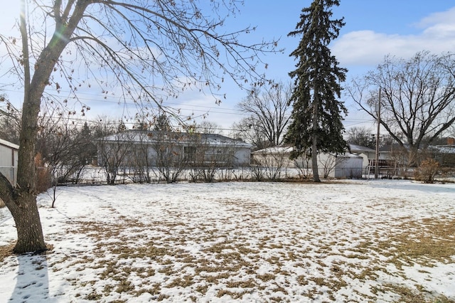 view of yard layered in snow