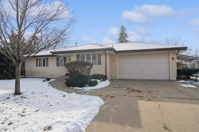 ranch-style home with a garage and a carport