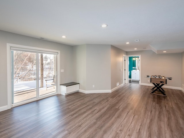 unfurnished living room featuring dark hardwood / wood-style floors