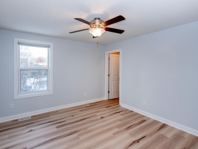 unfurnished room with ceiling fan and light hardwood / wood-style flooring