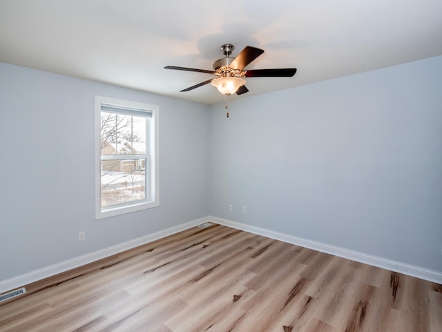 spare room with ceiling fan and light hardwood / wood-style floors