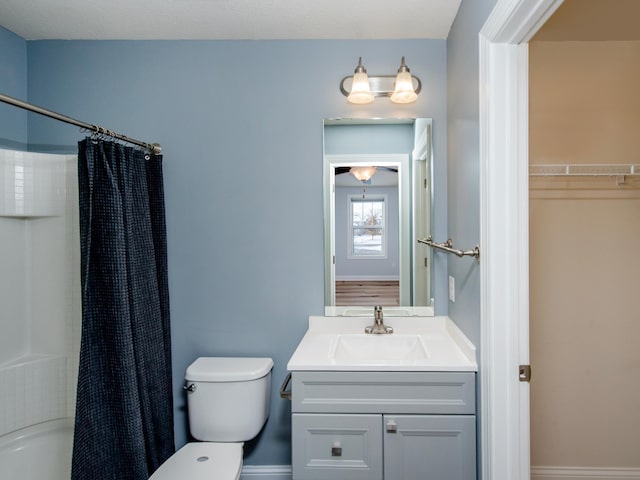 full bathroom featuring toilet, vanity, and shower / bathtub combination with curtain