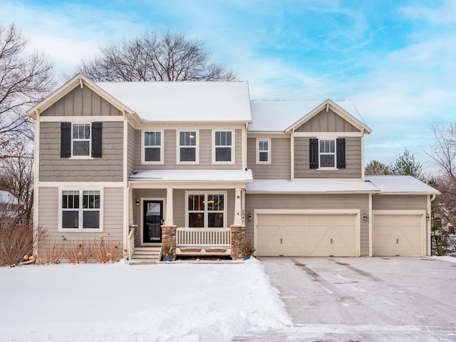 view of front of home featuring a garage and covered porch