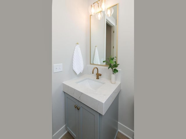 bathroom with vanity and baseboards