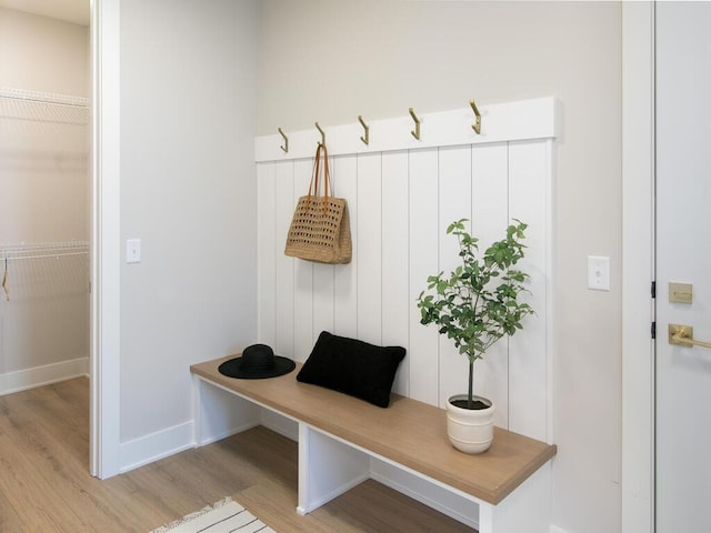 mudroom featuring light wood-type flooring and baseboards