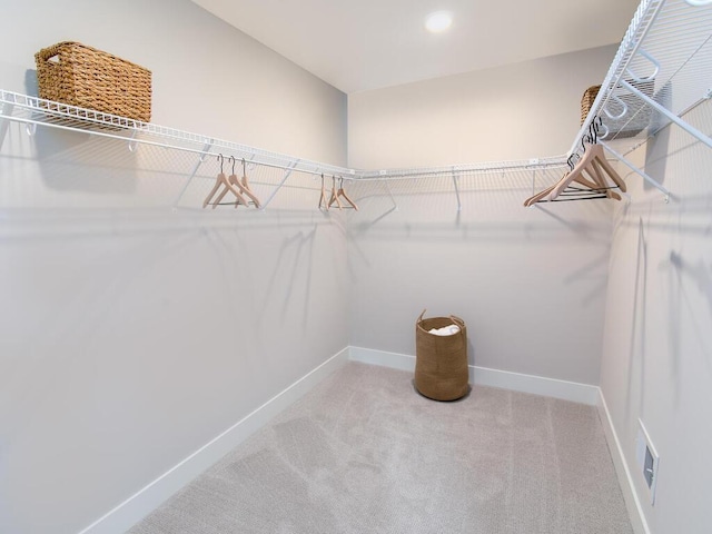 walk in closet with carpet floors and visible vents