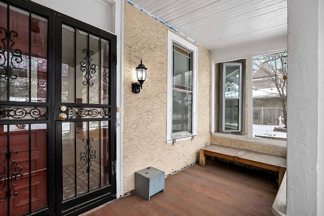 doorway to property featuring french doors and stucco siding