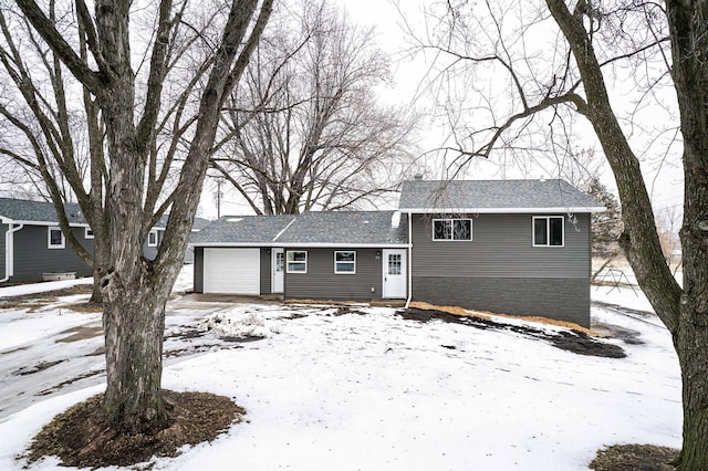 split level home featuring a garage