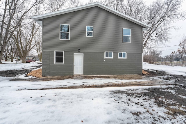 view of snow covered house