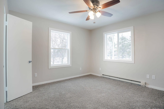 empty room with carpet floors, ceiling fan, and baseboard heating