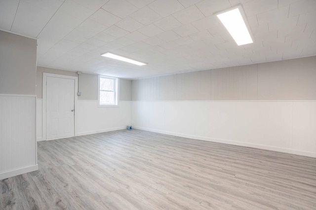 basement featuring light hardwood / wood-style floors