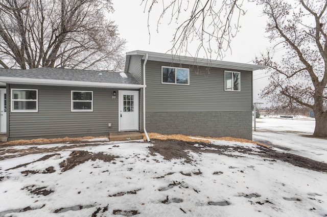 view of snow covered house