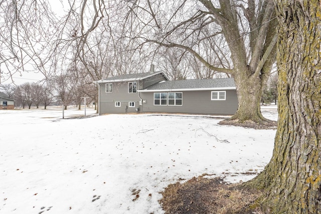 view of snow covered house