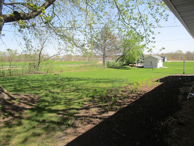 53 Eastview Dr, Hancock, MN 56244 - view of grassy yard with an outdoor structure