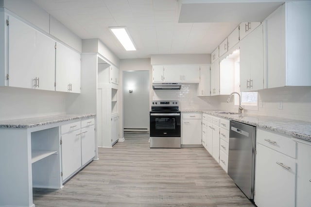 53 Eastview Dr, Hancock, MN 56244 - kitchen with appliances with stainless steel finishes, under cabinet range hood, a sink, a baseboard heating unit, and backsplash