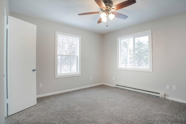 53 Eastview Dr, Hancock, MN 56244 - spare room with a baseboard radiator, carpet flooring, healthy amount of natural light, and baseboards