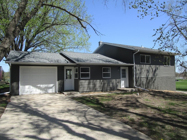 53 Eastview Dr, Hancock, MN 56244 - view of front of home with a garage and concrete driveway