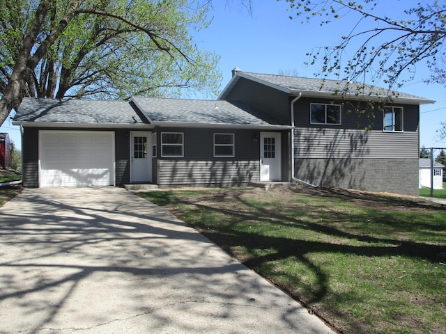53 Eastview Dr, Hancock, MN 56244 - tri-level home with an attached garage, concrete driveway, roof with shingles, and a front yard