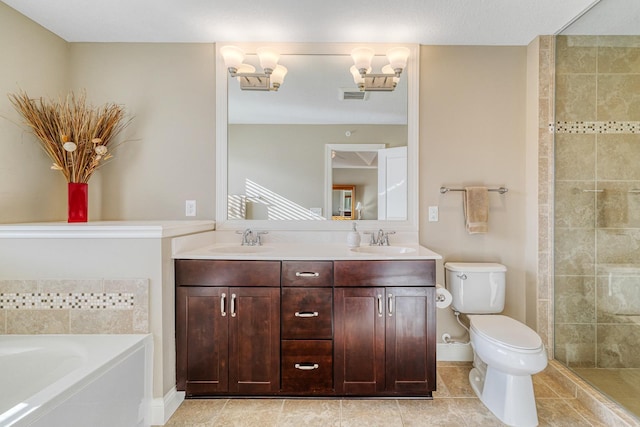 bathroom featuring vanity, toilet, and a tub to relax in