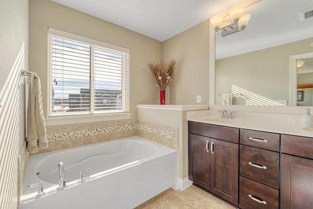 bathroom with vanity, a bath, and tile patterned floors