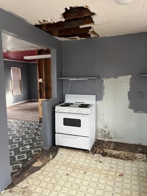 kitchen with white gas stove